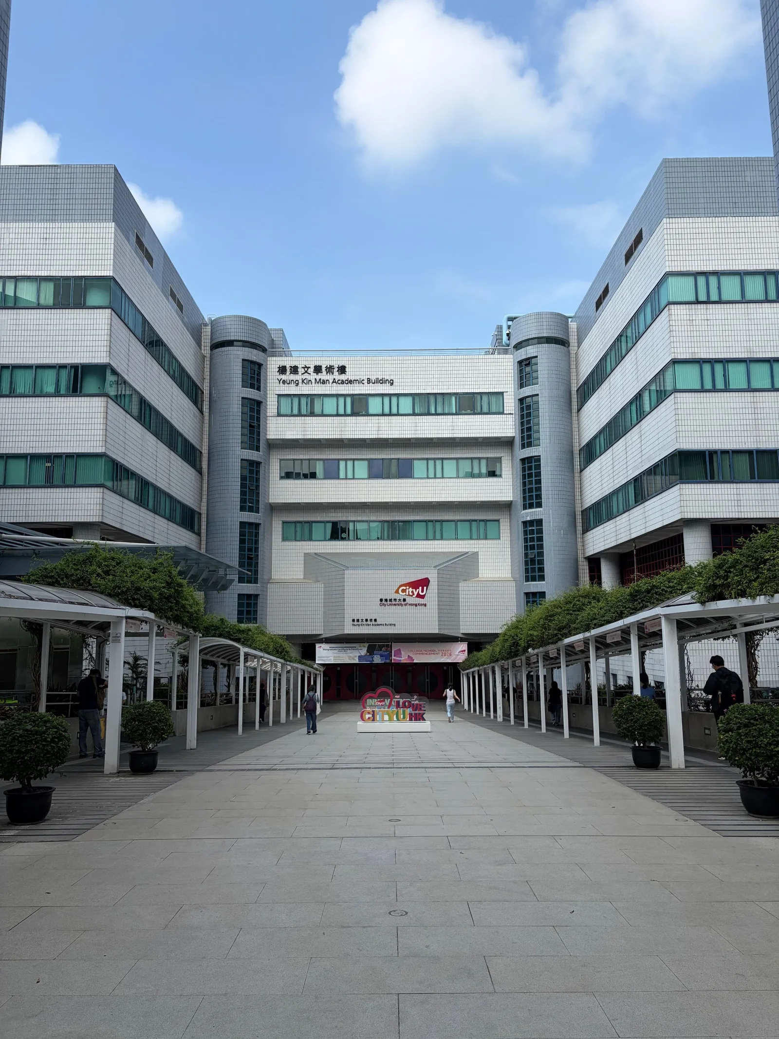 The buildings of City University of Hong Kong come into view.