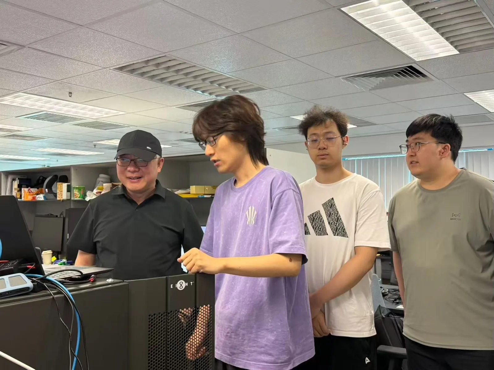 Watching PhD and master's students from our group present their research to Professor Z. Y. Dong, Head of Department. I am first from the right, in the olive-green T-shirt.